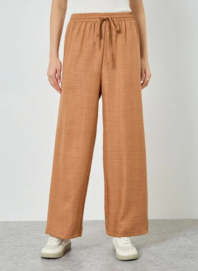 Styli Women Beige Linen Look Wide Leg Trousers